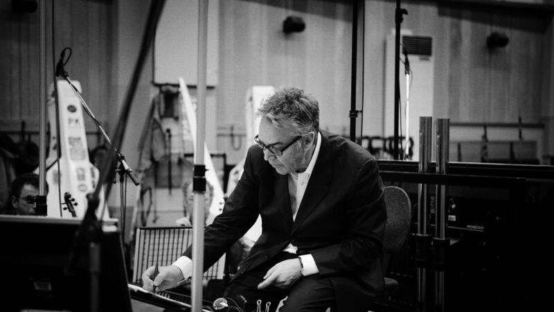 Black and white image of Howard Shore scoring in a studio