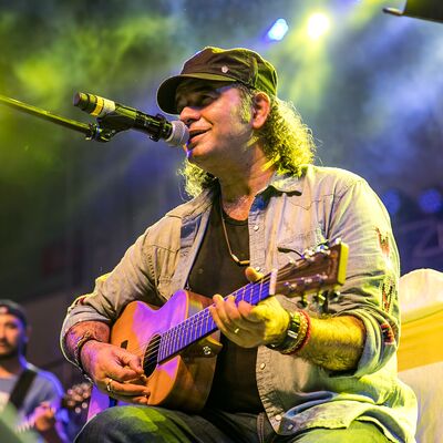 Mohit Chauhan playing guitar and singing