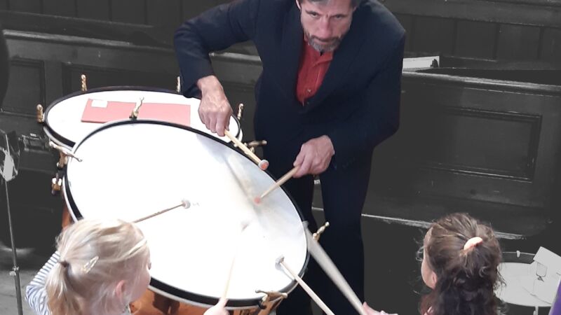 A drum being played for children.