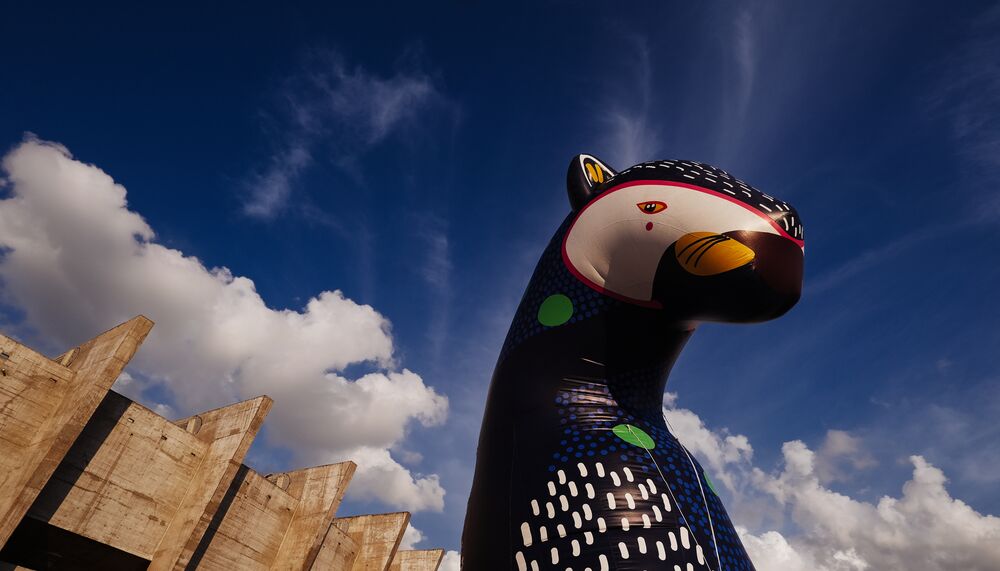 An inflatable animal outside a concrete building