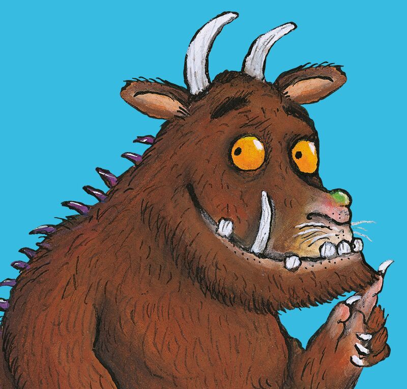 The Gruffalo character against a blue background, looking to the left and smiling.