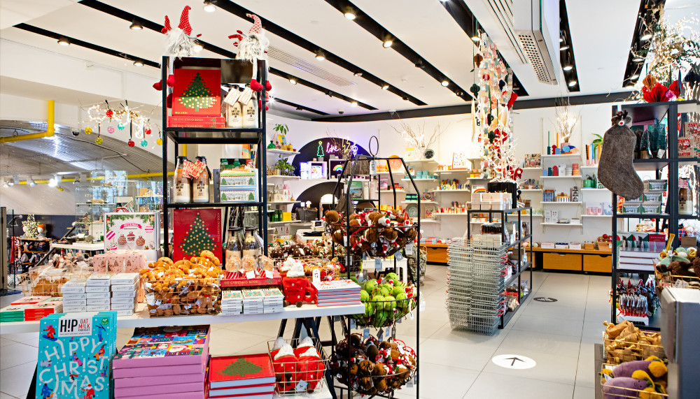 Image of the Southbank Centre shop interior, with Christmas displays and decorations hanging from the ceiling.