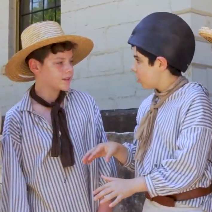 Two boys dressed in convict clothes