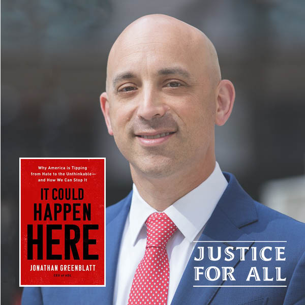 Jonathan Greenblatt in a blue suit and red tie.