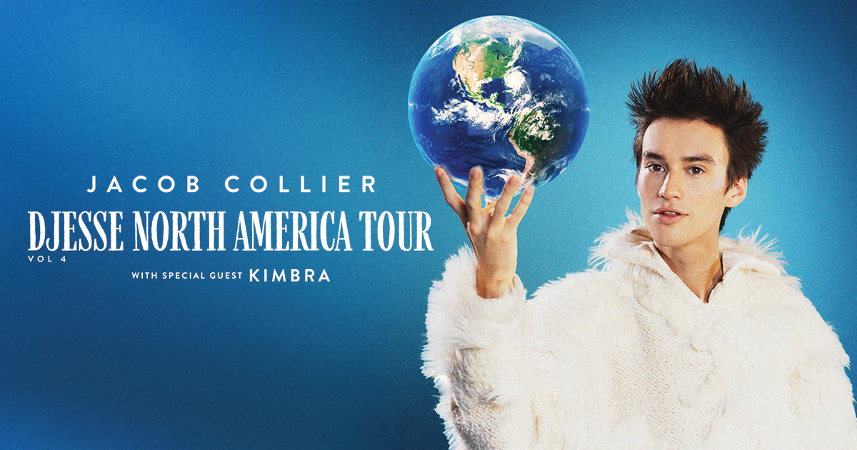 Jacob Collier wearing a white fluffy coat holding up a large specular globe with his fingers. 