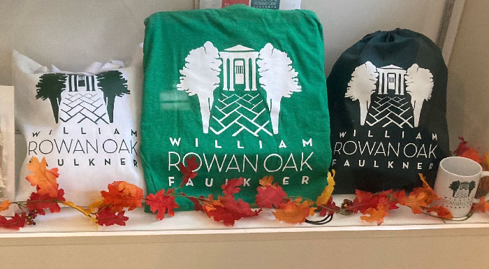 Rowan Oak merchandise: tote bag, t-shirt, backpack, and mug