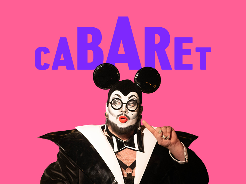 A drag artist wearing Mickey Mouse ears. Text reads CABARET