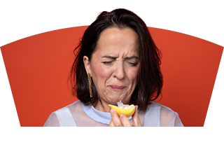 Comedian Luisa Omielan biting into a lemon