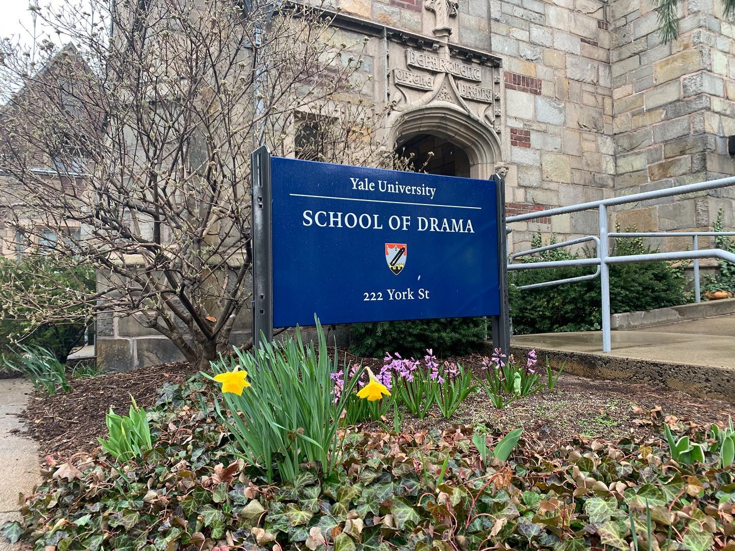 yale school of drama sign with flowers, in front of the university theater