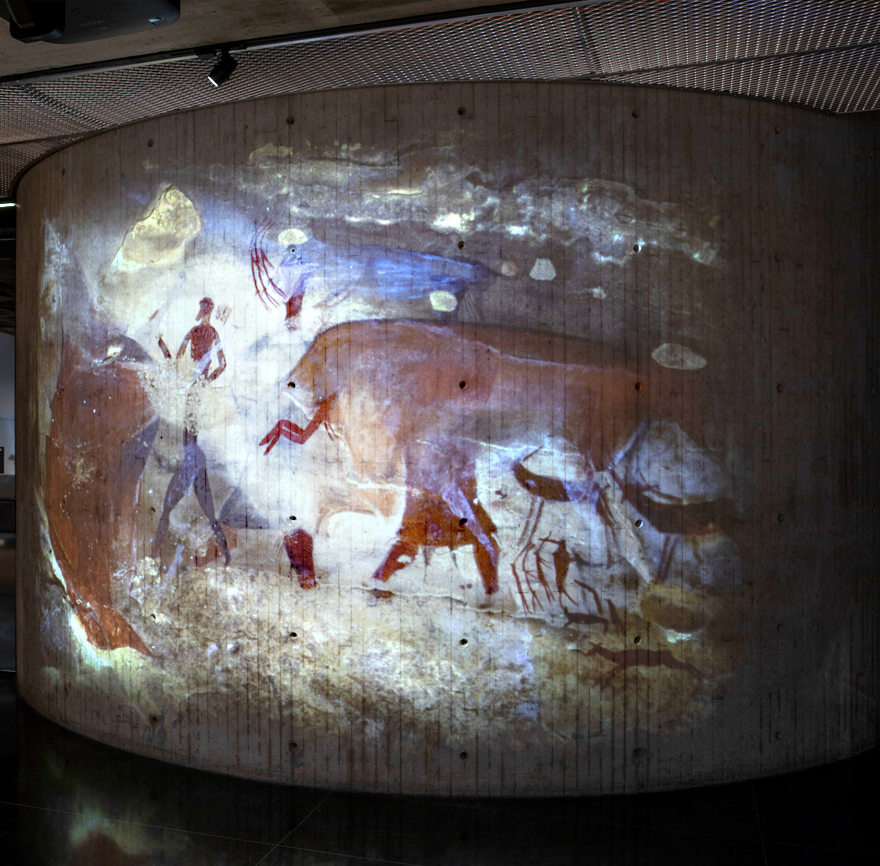 a photo of ancient African art being projected onto a curved surface